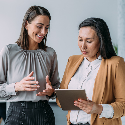 Two Canadian, female economist having a conversation with one another.